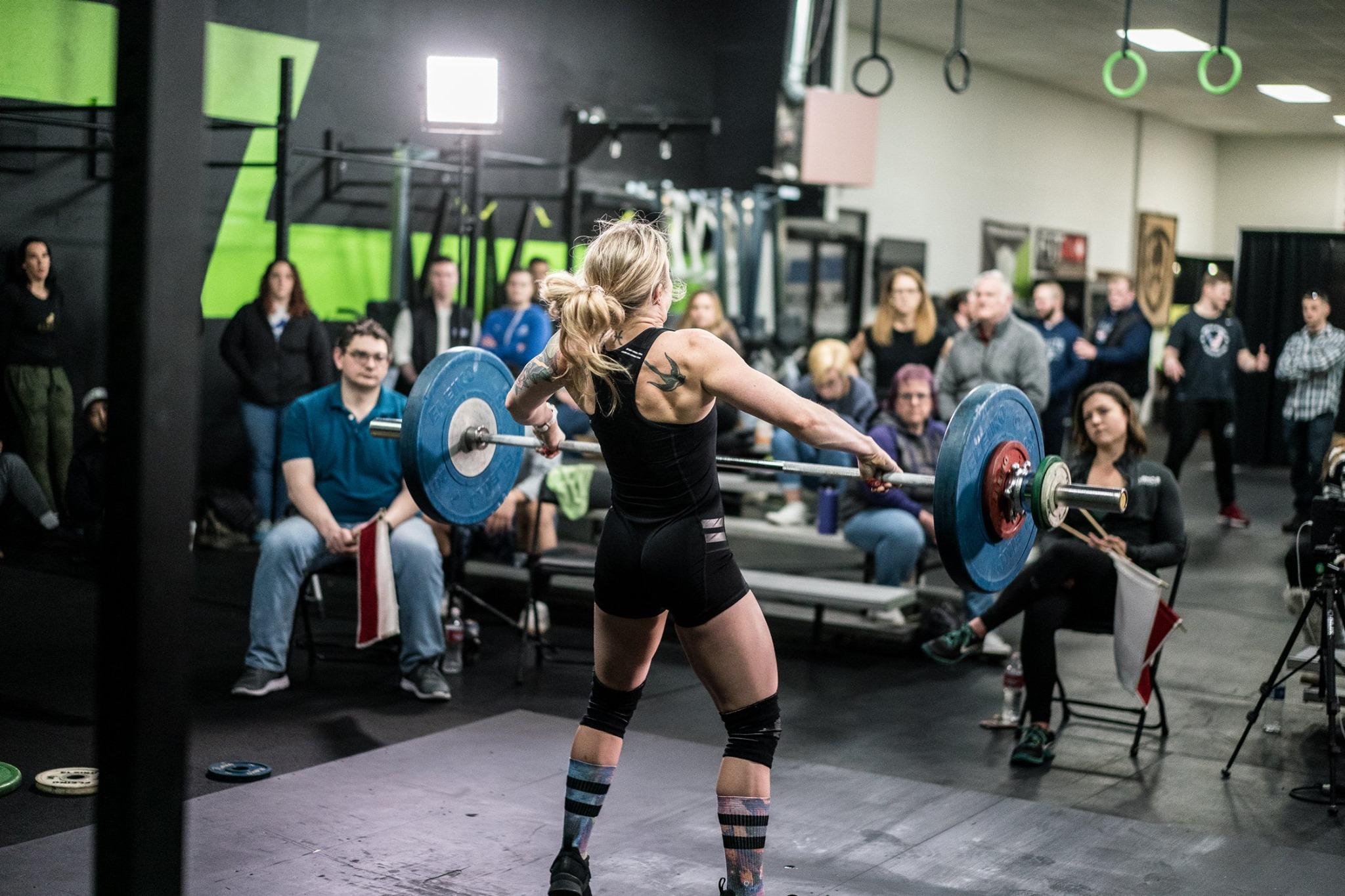 An athlete lifting on a platform at Armor Athletics